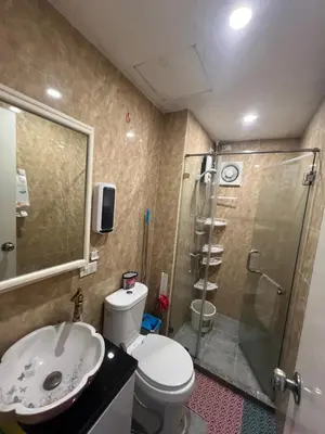 a bathroom with a shower and a toilet and a sink at Apartment 1BR Condo Manila- Suntrust Adriatico Gardens Malate in Manila