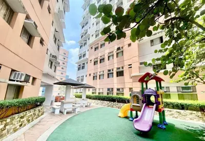 a playground with a slide in the middle of a building at Apartment 1BR Condo Manila- Suntrust Adriatico Gardens Malate in Manila