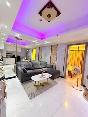 a living room with a couch and a table at Apartment 1BR Condo Manila- Suntrust Adriatico Gardens Malate in Manila