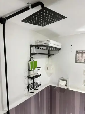 a bathroom with a drying rack in the wall at SJ Vistacation in Tanza