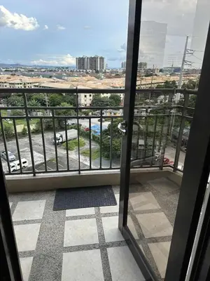 a balcony with a view of a parking lot at Cypress Towers Staycation in Manila
