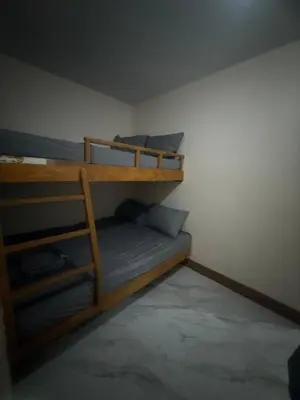 a bedroom with two bunk beds in a room at Affordable makati 908 deluxe in Manila