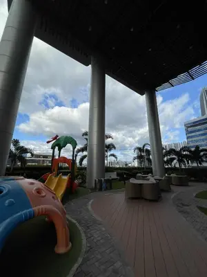 a playground with a slide in a building at Lush Urban Studio in Manila