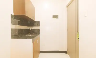 a kitchen with a sink and a counter at UrbanView at Mherylle's Apartment near UST Manila in Manila