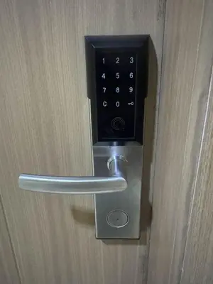 a door with a metal handle on a door at Summer At The Shore in Manila