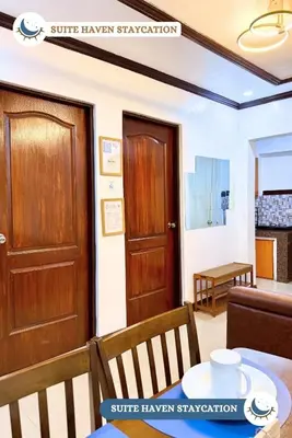 a room with a door and a table and chairs at Suite Haven Staycation in Sampong