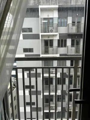 a view of an apartment building from a window at Mystix's Pad in Manila