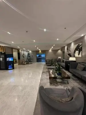 a lobby with couches and a christmas tree in it at Mystix's Pad in Manila
