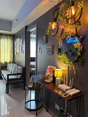 a room with a table and a mirror at Mystix's Pad in Manila