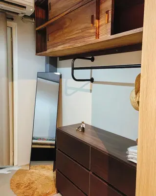 a dressing room with a dresser and a mirror at Grand Line Hideout in Manila