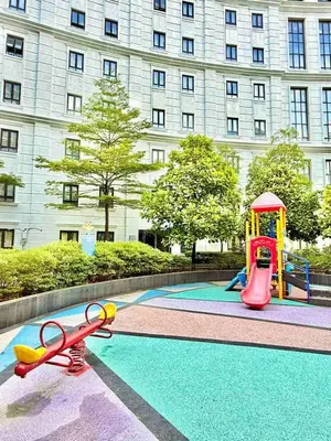 a pool with a playground in front of a building at Santis Place at Eighty One Newport Blvd Across NAIA Terminal 3 in Manila