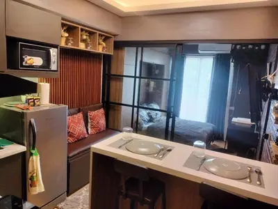 a small room with a sink and a refrigerator at Fully Furnished Condo Near BGC in Manila