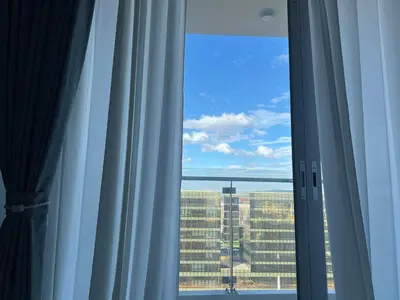 a window with a view of a city at Modern Boutique Spacious Apartment Near Airport OKADA SOLAIRE MOA in Manila