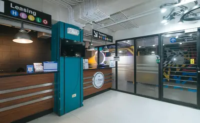 a fast food restaurant with a train in the background at RedDoorz Premium at MyTown New York in Manila