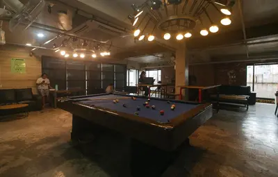 a billiard room with a pool table in it at RedDoorz Premium at MyTown New York in Manila