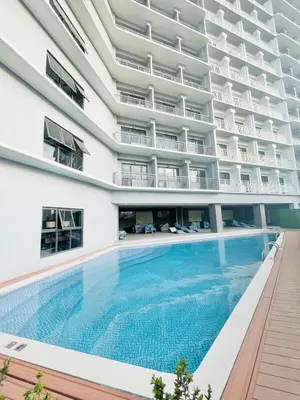 an empty swimming pool in an apartment building at City SkyView - Level 24 - Pool - Lush Residences in Manila