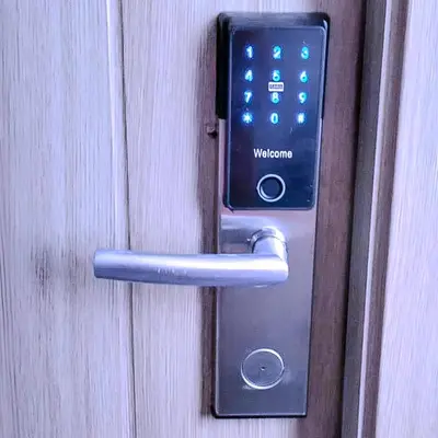 a door handle with a cell phone in it at Relax in Comfort at Shore 2 Residences Mall of Asia-Pasay in Manila
