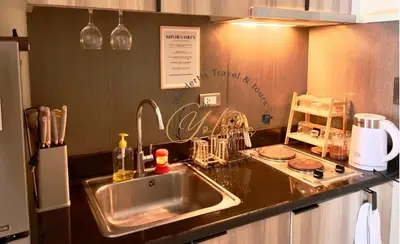 a kitchen with a sink and a counter top at 1BR Unit for 2 pax Makati City in Manila