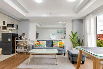 a living room with a couch and a table at Air Bel & Be! Your space, Your calm, Your comfort in Manila