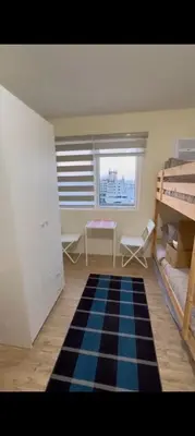 a bedroom with a checkered floor and bunk beds at ANANDA SQUARE studio unit in Manila