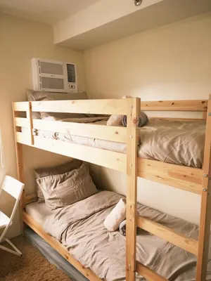two bunk beds in a room with at ANANDA SQUARE studio unit in Manila