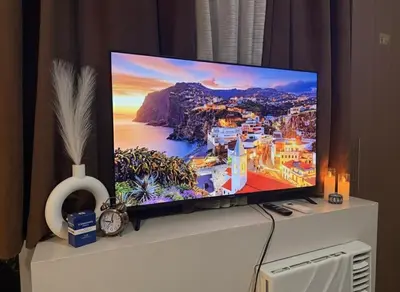 a flat screen tv sitting on top of a dresser at Condo in Pasay Across Airport NAIA Terminal 3 Pool View in Manila