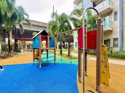 a playground with a slide and a slide at Condo in Pasay Across Airport NAIA Terminal 3 Pool View in Manila