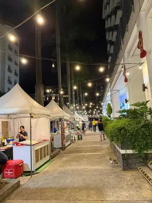 a row of tents on a street at night at Condo in Pasay Across Airport NAIA Terminal 3 Pool View in Manila