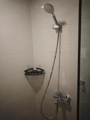 a shower with a shower head in a bathroom at Venice Mall Area Mckinley Hills Taguig in Manila