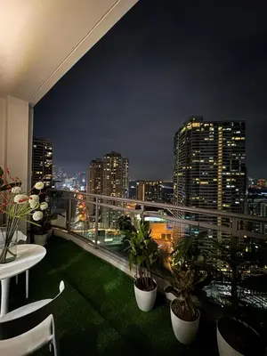 a balcony with a view of a city at night at zuvyph in Manila