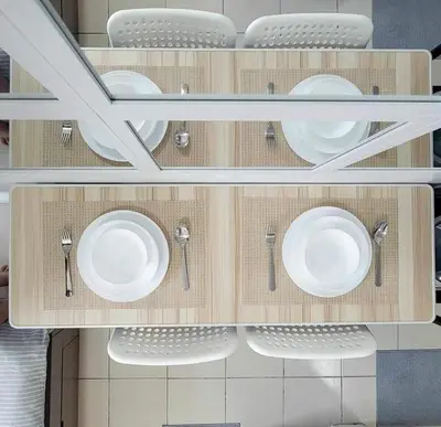 a cabinet with white plates and utensils in it at Erro Place Wi-Fi 200mbps & Netflix in Manila
