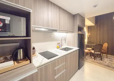 a kitchen with a sink and a counter top at The Luxe Haven at BGC in Sampong