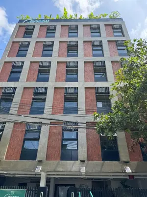 a tall building with lots of windows at Canopyproperties in Manila