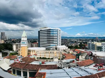a view of a city with a tall building at Venice Luxury Residences Grand Canal View- Tower E in Manila
