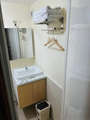 a bathroom with a sink and a mirror at 17th Casa Horizon in Manila