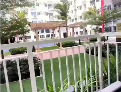 a view from the balcony of a building at Modern Loft-Style Condo - Perfect for Families or Couples in Manila