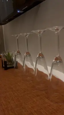a row of wine glasses sitting on top of a table at CitySoul in Manila