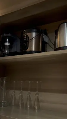 a row of wine glasses sitting on a shelf at CitySoul in Manila
