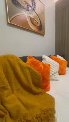a blanket laying on top of a bed at CitySoul in Manila