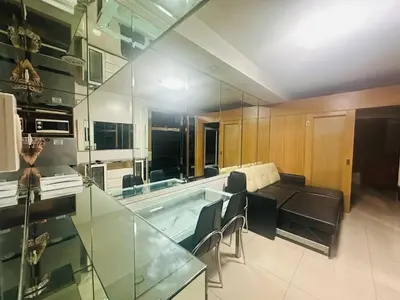 a large kitchen with a tub and a table and chairs at Ritzy Pasay Getaway - Entire Apartment for Rent in Manila
