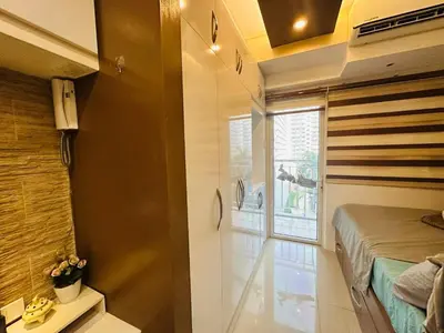 a small room with a bed and a window at Charming 1-Bedroom Apartment in the Heart of Pasay City in Manila
