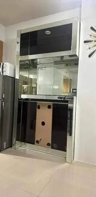 a kitchen with a glass counter top in a room at Ultra Pasay City Apartment for Rent - Perfect for Short-Term Stay Front of MOA in Manila