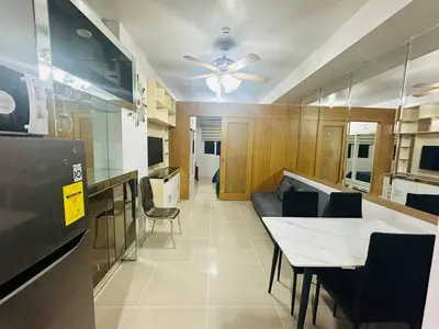 a kitchen and dining room with a table and chairs at Ultra Pasay City Apartment for Rent - Perfect for Short-Term Stay Front of MOA in Manila