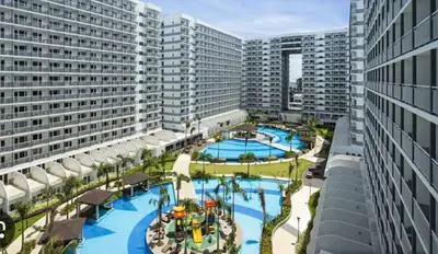 an aerial view of a resort with two pools at Timeless Pasay City Apartment for Rent in Manila