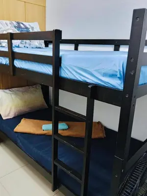 a couple of bunk beds in a room at Gentle Pasay City Apartment for Rent - Perfect Family Getaway Near Mall of Asia in Manila