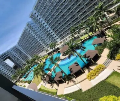 a rendering of a building with a swimming pool and a building at Gentle Pasay City Apartment for Rent - Perfect Family Getaway Near Mall of Asia in Manila
