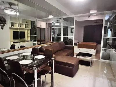 a living room with a couch and a table at Yare Pasay City Apartment for Rent Perfect for Stay front of Mall of Asia in Manila