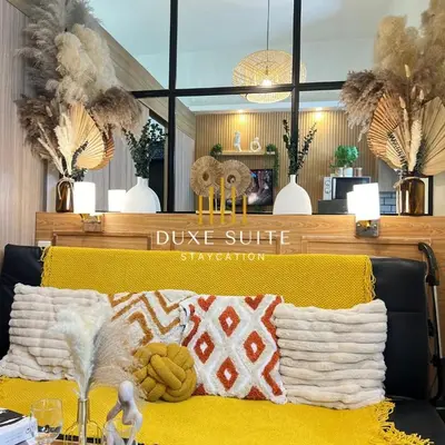 a store with a yellow couch with a pillow on it at Staycation in RLX in Manila