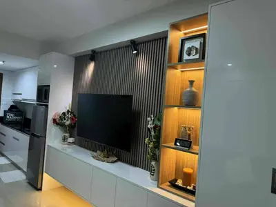 a living room with a flat screen tv on a wall at Chic Retreat in Pasay City - Scandinavian with Balcony facing Mall Of Asia in Manila