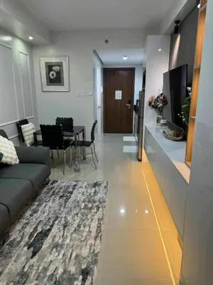 a living room with a couch and a table at Chic Retreat in Pasay City - Scandinavian with Balcony facing Mall Of Asia in Manila